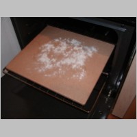 Pizza 06 - flour the baking stone.JPG